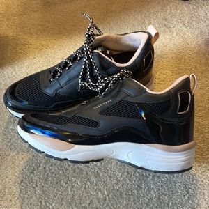 Skechers memory foam shoe with lift.